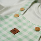 SALOPETTE IN COTONE VERDE CON BODY MANICA LUNGA